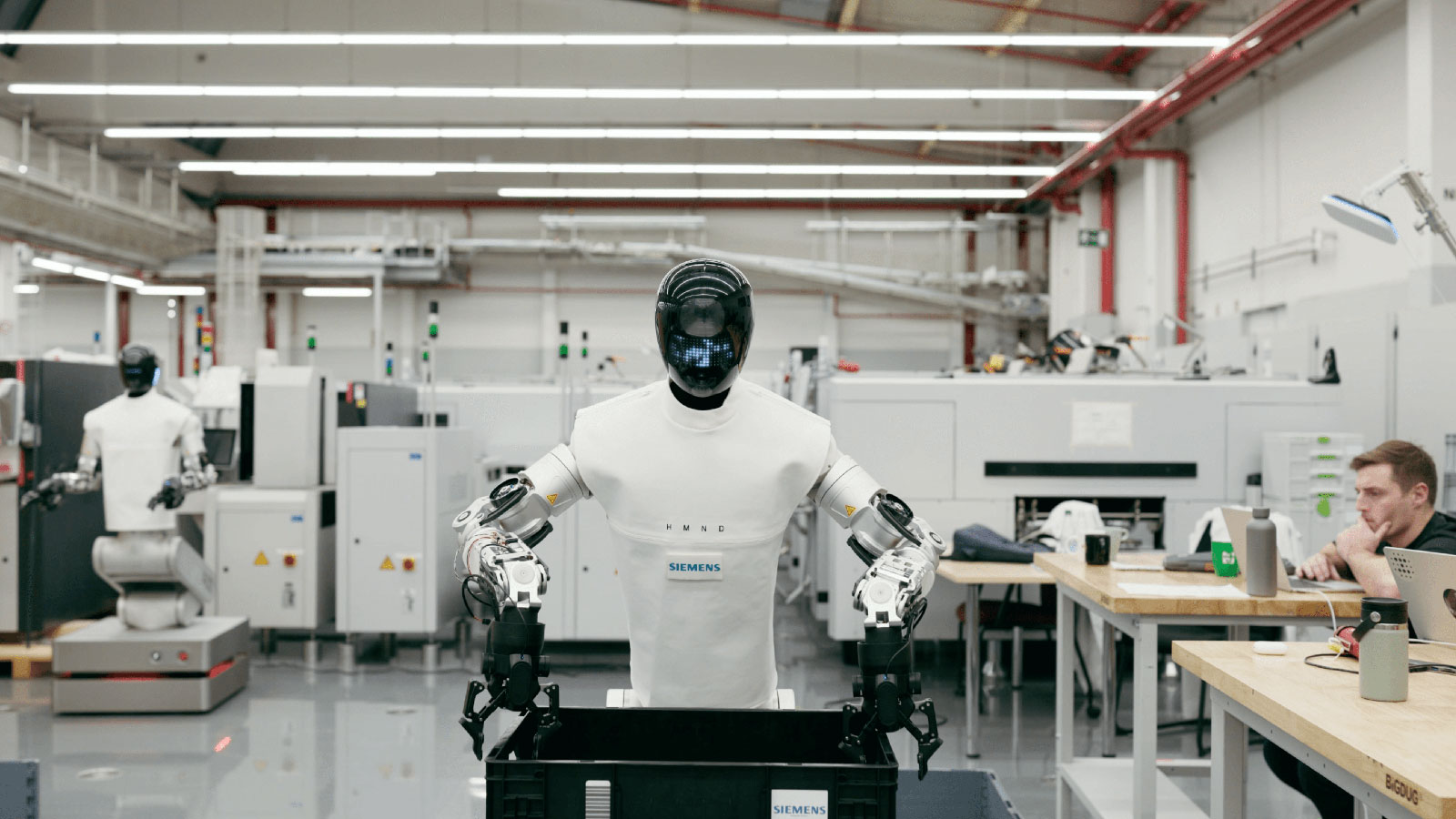 Humanoid's HMND 01 Alpha on the shop floor at Siemens' Erlanger, Germany electronics manufacturing facility. Humanoid's HMND 01 Alpha on the shop floor at Siemens' Erlanger, Germany electronics manufacturing facility.