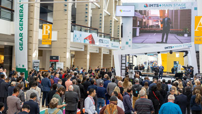 AMT President Douglas Woods presenting on the IMTS+ Main Stage in 2024. The Main Stage will return in 2026, along with many other presentation areas throughout the show floor, where visitors can learn from technology experts throughout each day.